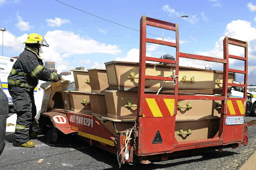 DEATH ON THE ROAD A trailer carrying corpses of paupers and stillborn babies broke down on the M1 South, Johannesburg, on Wednesday.Picture: Mduduzi Ndzingi