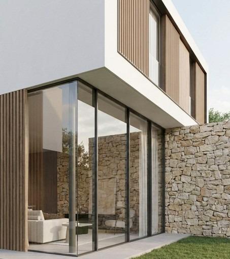 Luxury villa for sale in Benidorm (Spain) - Modern house exterior, stone walls