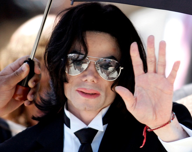 Michael Jackson waves to supporters as he leaves the Santa Barbara County Courthouse after he was found not guilty in Santa Maria, California, on June 13 2005.