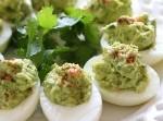 Guacamole Deviled Eggs was pinched from <a href="http://www.backroadsliving.com/recipes/guacamole-deviled-eggs-not-green-eggs-and-ham/" target="_blank">www.backroadsliving.com.</a>