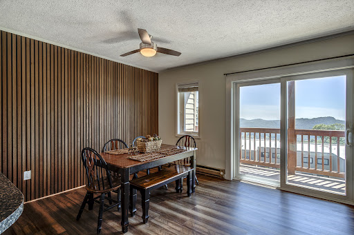 Dining room with wood paneled wall - Buy this luxury house in Banner Elk, 2 bedrooms