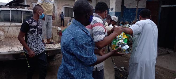 The body of Joseph Macharia arrives at his mother Annerose Waruguru's house in Wayani, Magongo, in Mombasa county on Sunday.