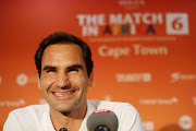 Roger Federer smiles during his trip in South Africa. 