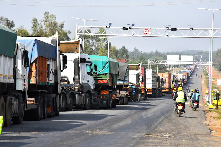 Long distance trucks queue along the Malaba-Bungoma highway at Amagoro on January 4, 2022.