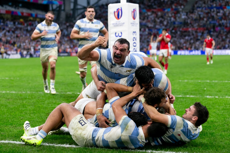 Agustín Creevy celebrates Argentina's second try with his teammates in the Rugby World Cup quarterfinal against Wales at Stade Velodrome in Marseille on Saturday.