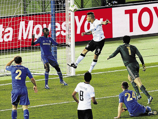 WINNER: Paolo Guerrero of Brazil's Corinthians heads the ball past Chelsea's Ramires to score the only goal in the Fifa Club World Cup final in Yokohama, Japan, on Sunday