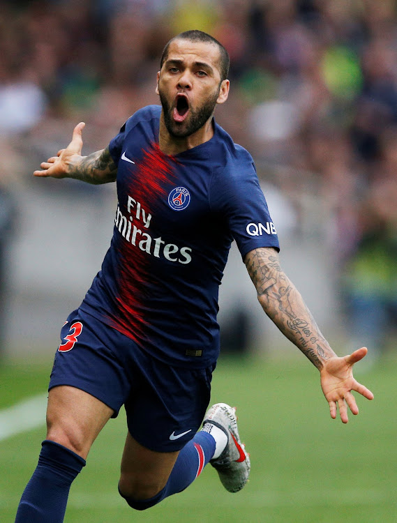 Paris St Germain's Dani Alves celebrates after scoring during a recent match