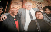 Barney Mokgatle, left, with Angelo Agrizzi, The photograph hangs on a wall of the Barney Mogatle Foundation office. 