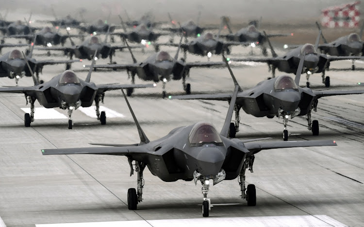 F-35A fighter jets are seen during a military exercise "Elephant Walk" at an airbase, in this handout provided by the South Korean Defense Ministry on March 25, 2022.