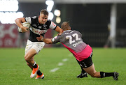 Jeremy Ward of the Sharks evades a tackle from Jerome Pretorius of the Pumas during the Currie Cup match at the GrowthPoint Kings Park in Durban on September 7, 2018.