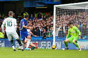 Cesar Azpilicueta of Chelsea scores his side's equalising goal past Plymouth Argyle goalkeeper Michael Cooper in the FA Cup fourth-round match at Stamford Bridge in London on February 5 2022.