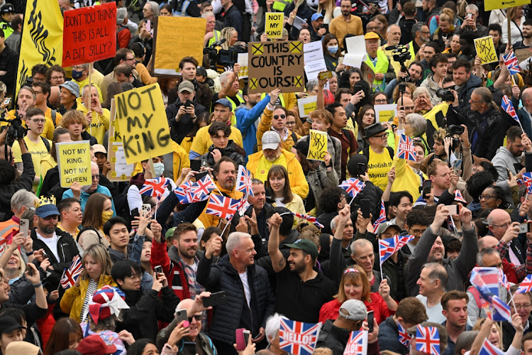 Protesters gather amongst well-wishers in Trafalgar Square ahead of the Coronation of King Charles III and Queen Camilla on May 6, 2023 in London, England. The Coronation of Charles III and his wife, Camilla, as King and Queen of the United Kingdom of Great Britain and Northern Ireland, and the other Commonwealth realms takes place at Westminster Abbey today. Charles acceded to the throne on 8 September 2022, upon the death of his mother, Elizabeth II.