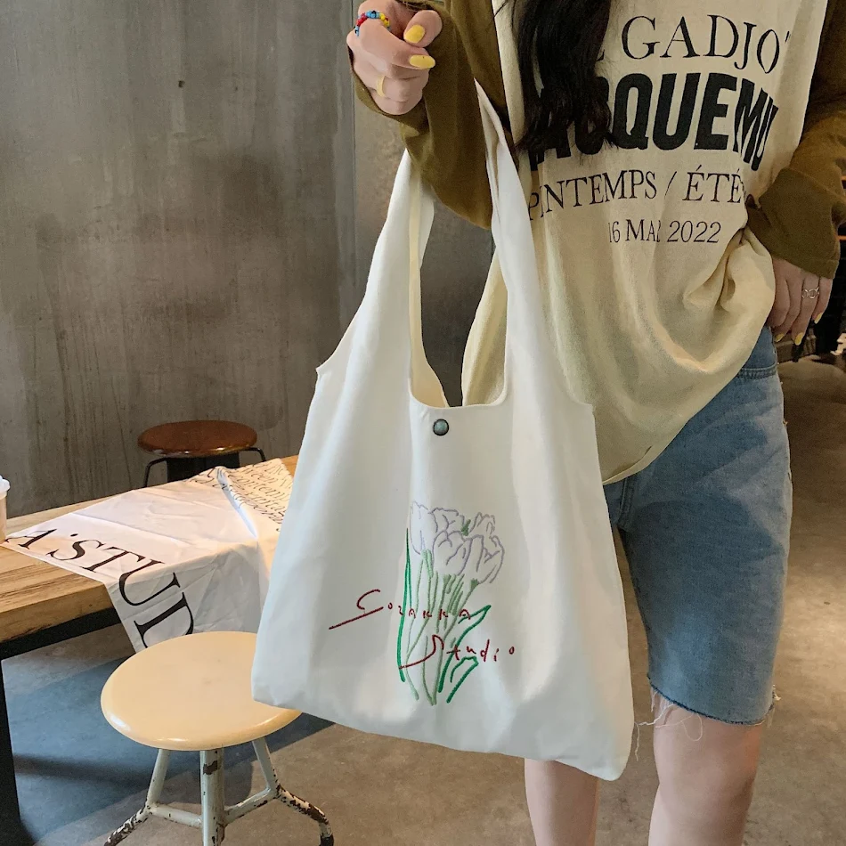 Nouveau sac à bandoulière en toile Tulip grande capacité, idéal pour transporter tous vos essentiels avec style et confort, parfait pour le quotidien.