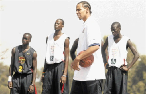 LESSON TIME: NBA player Thabo Sefolosha drills young players during a Basketball Without Borders clinic . PHOTO: KEVIN SUTHERLAND