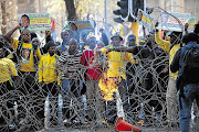 ANC Youth League supporters came out in their numbers last week to demonstrate their support for embattled league leader Julius Malema. Protesters attacked journalists and police and threw bottles and stones at businesses during a day of rioting Picture: ALON SKUY