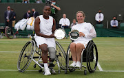 Kgothatso Montjane of South Africa and Lucy Shuker of Great Britain pose with the runners-up trophy after losing their Ladies' Wheelchair Doubles Final match against Yui Kamiji of Japan and Jordanne Whiley of Great Britain.