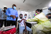 Doing his part: A youngster gets vaccinated at OR Tambo Community Health Centre in Diepsloot. Picture: Gallo Images/Sydney Seshibedi