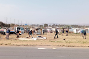 JMPD officers remove the structures in Freedom Park, Johannesburg.