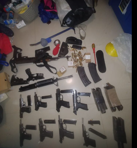 Police seized nine pistols, two rifles and magazines with live ammunition in the operation.