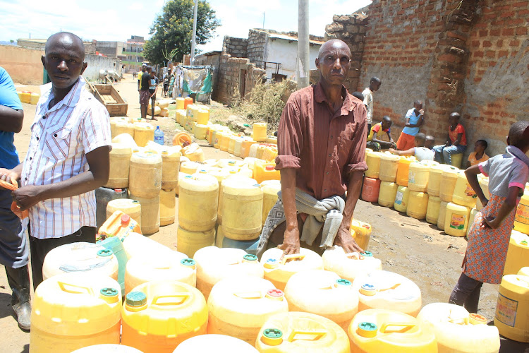 Residents at a water point in Tseikuru, Mwingi North.