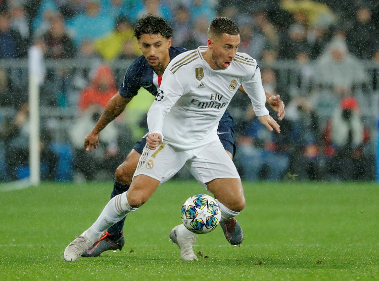 Real Madrid's Eden Hazard in action with Paris St Germain's Marquinhos