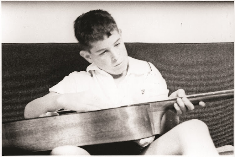 A young Johnny Clegg with his guitar.