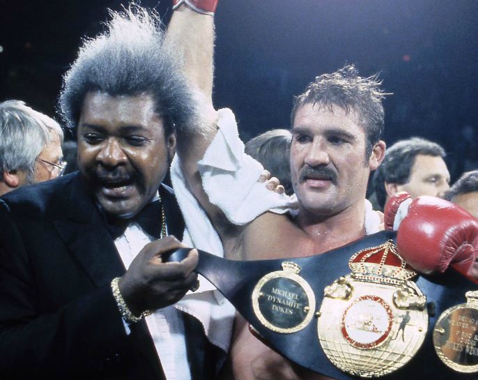 Promoter Don King with world heavyweight champion Gerrie Coetzee at the Coliseum, September 23, 1983