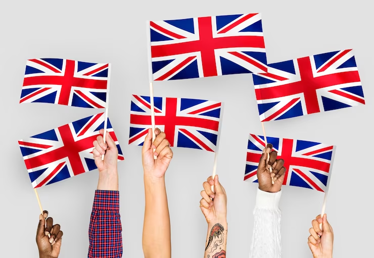 Students waving the Union Jack flag, representing the essence of UK education.