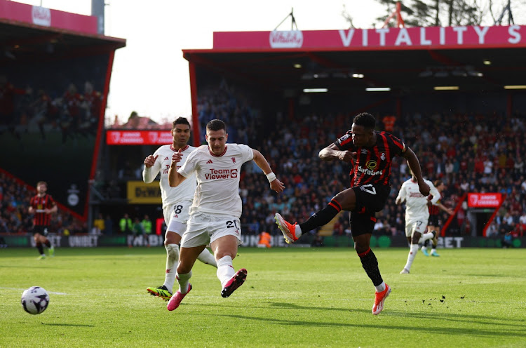 AFC Bournemouth's Luis Sinisterra shoots at goal as Manchester United's Diogo Dalot reacts in the Premier League match at Vitality Stadium in Bournemouth on Saturday.