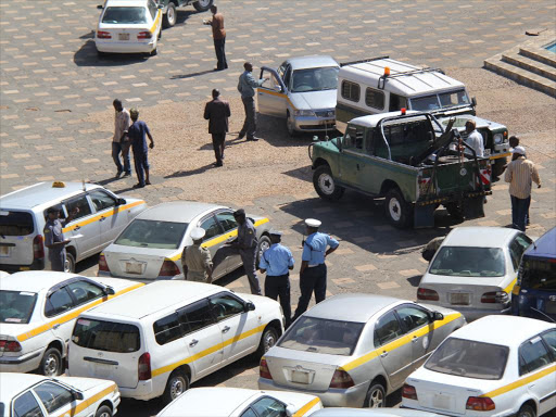 Taxis parked at KICC grounds during a strike by matatu and taxi drivers on the increased parking fees by the county government/FILE