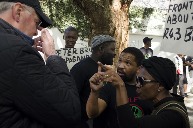 Members of the Black First Land First, Thandiswa Yaphi, has a heated debate with former editor of Business Day and Financial Mail Peter Bruce on June 29, 2017 in Johannesburg, South Africa.