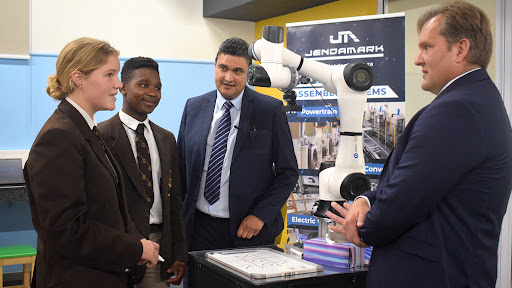 Incoming Woodridge College head girl Hannah Praetorius and head boy Buzwe Pango interact with the 4IR technologies available at the centre.