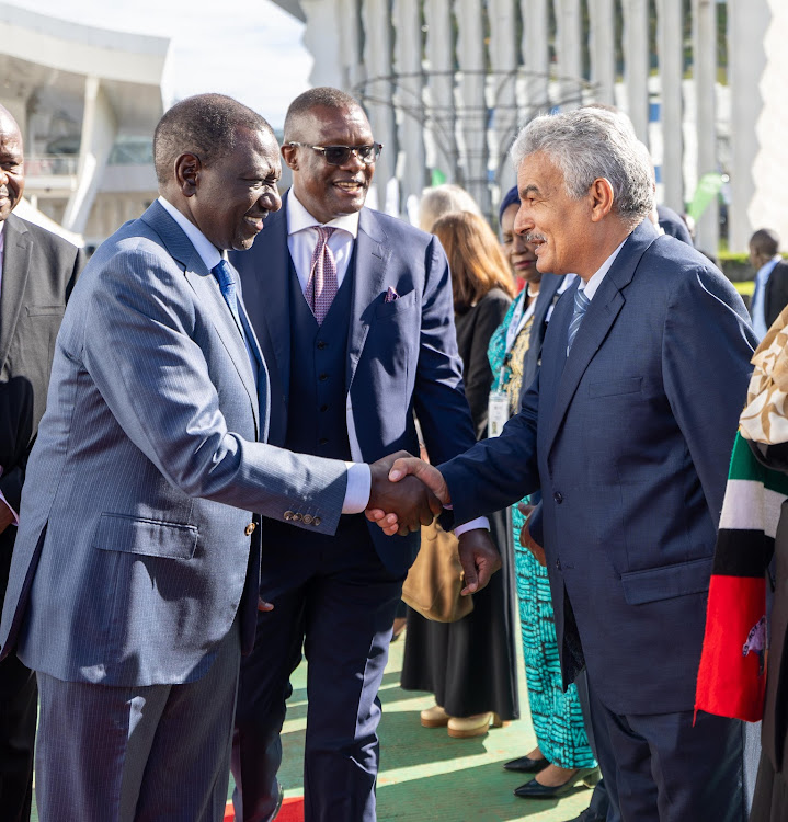 President William Ruto greets a guest after arriving at Uhuru Gardens, Nairobi for the opening of Connected Africa Summit 2024 on April 22, 2024.