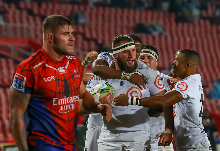 The Emirates Lions stand-in captain Malcom Marx looks dejected as the Cell C Sharks players celebrate the try of Thomas du Toit during the Super Rugby match at Ellis Park in Johannesburg on April 05, 2019.