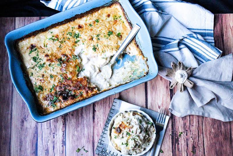 Baked Chicken And Dumplins With A Serving On The Side.