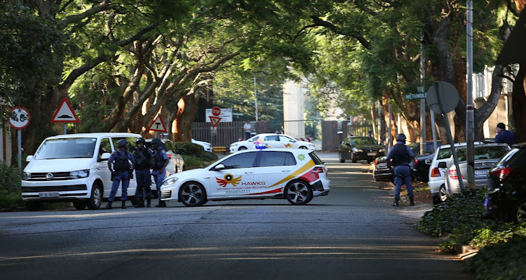 Two police officers are alleged to have paid an investigating officer to release confiscated vehicles.