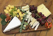 A delectable selection of cheeses on a cheeseboard.