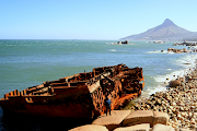 City of Cape Town deputy mayor Eddie Andrews stands alongside an aged Antipolis which now lies nestled between the rocks near the Twelve Apostles Hotel.