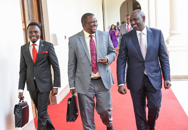 President William Ruto walking with cabinet secretaries before chairing his second cabinet meeting at State House on November 12, 2022