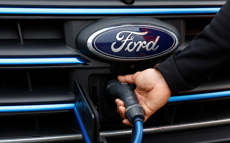 A charging cable is plugged into an electric Ford E-Transit in London, Britain. Picture: SUPPLIED