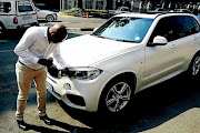 FEELS CHEATED: Zanovuyo Malusi says he was sold a supposedly new BMW car, in the picture, which he believes must have been involved in an accident prior to being sold to him as a new car Photo: Thulani Mbele