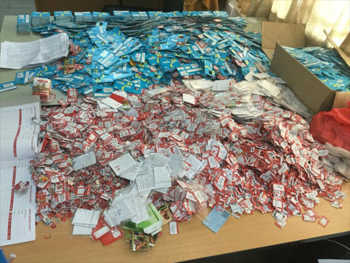 SIM cards which were confiscated from 11 suspects arrested for investigations into SIM swap fraud on Saturday, July 28, 2018. /COURTESY