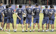 GEARING UP FOR MESSI:  Paraguay's national soccer team coach Gerardo Pelusso (centre) talks to players at a training session in Ypane, Paraguay, yesterday. Paraguay will face Argentina in their 2014 World Cup qualifying soccer match in Cordoba, Argentina, tomorrow.  
      PHOTO: REUTERS