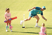 David Warner plays cricket with his children during an Australian training session at the Melbourne Cricket Ground on December 25 2022.