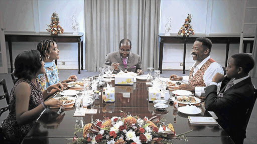 From left, Bona Mugabe with her mother Grace, father Robert, TV host Dali Tambo, and Mugabe's youngest son, Bellarmine, at lunch in State House in Harare.