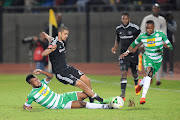 Didier Lebri (L) of Bloemfontein Celtic and Abbubaker Mobara (R) of Orlando Pirates during the Absa Premiership match at Dr. Molemela Stadium on May 10, 2017 in Bloemfontein, South Africa.