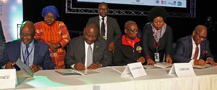 Sipho Pityana, President Cyril Ramaphosa, Bheki Ntshalintshali and Thulani Tshefuta signing the Job summit frame work agreement in Midrand on October 4 2018