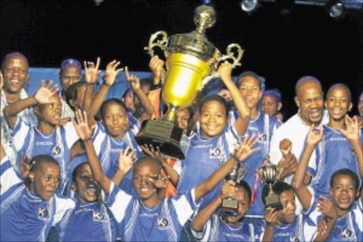 WE'RE RICH : KDC Primary School Soccer League winners Isulihle Primary School scooped R100000 and a trophy. pHOTO: bAFANA mAHLANGU