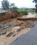 Road damaged due to sinkhole.