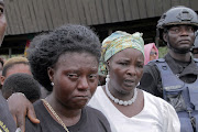 Manyi Tita mourns her 10-year-old daughter who was killed by unidentified assailants in a classroom of a secondary school during a mass funeral in Kumba, Cameroon November 5, 2020. 